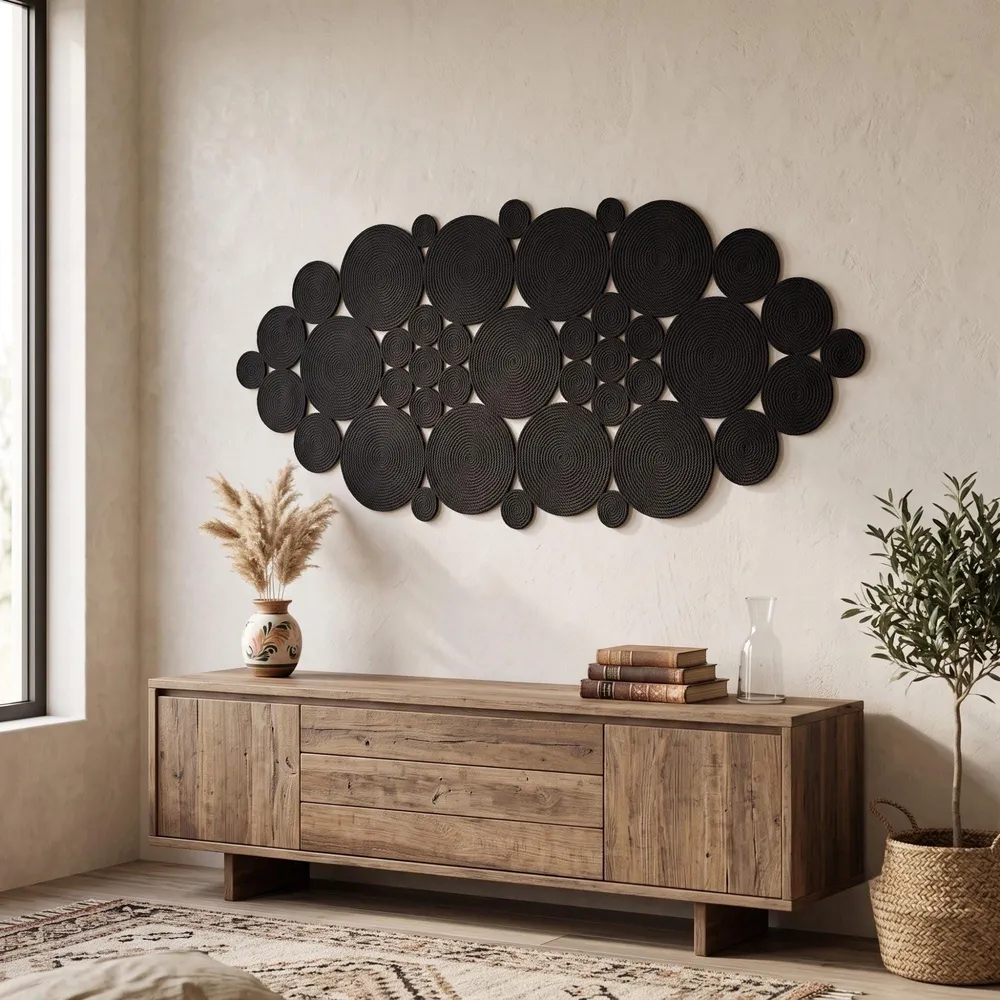Black rope mandala wall art shown next to furniture for scale, highlighting its large statement size on the wall.